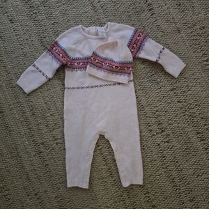 pink knitted baby onesie and matching hat set